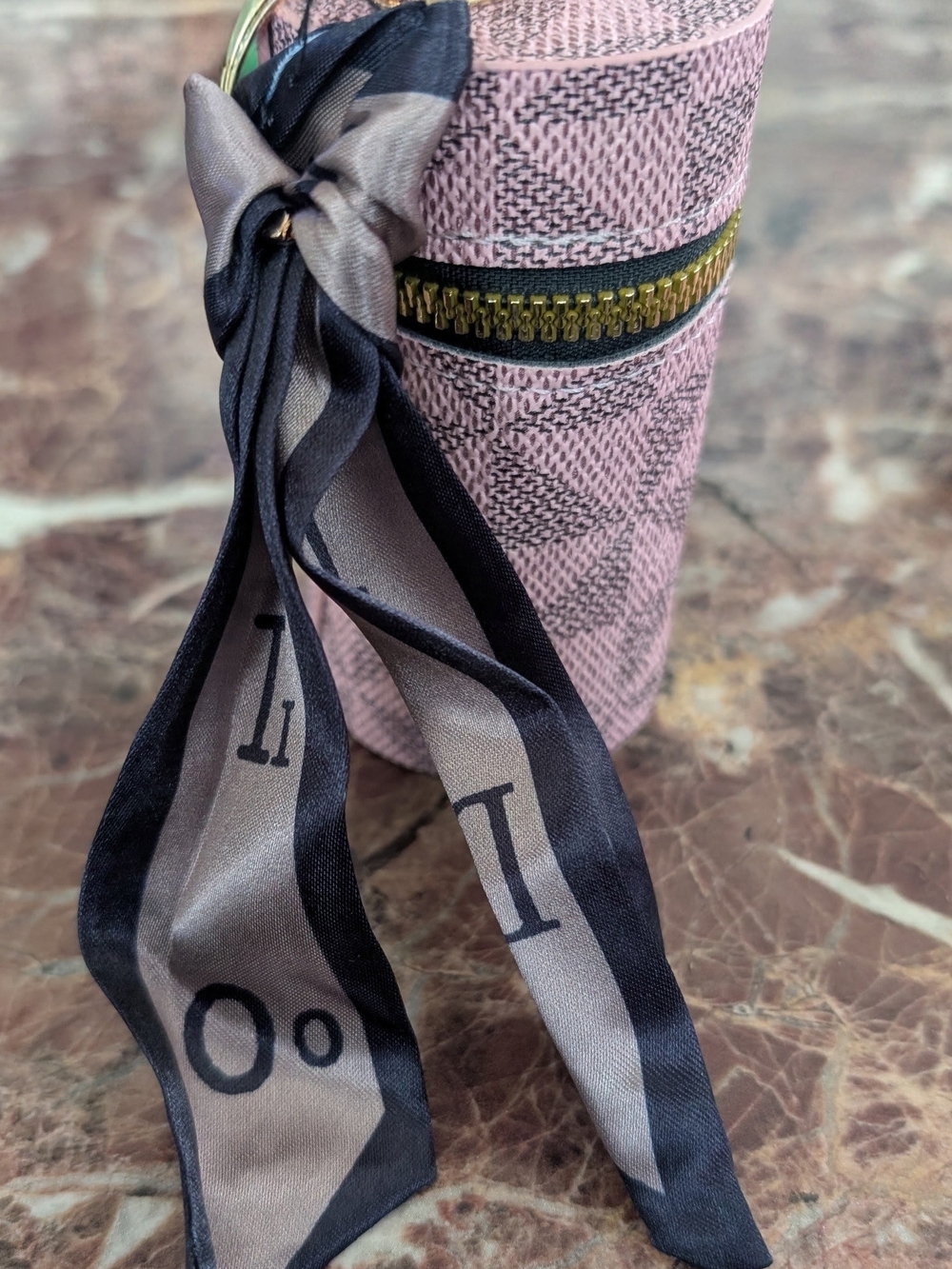 Pink Textured Cylindrical Jewelry Case with Black Ribbon
